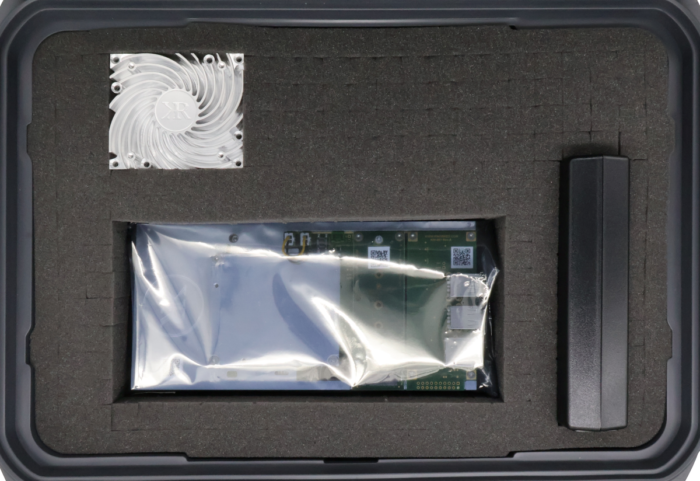 KRC-2000 evaluation carrier with KRM-4 RFSoC FPGA module in ESD bag, heat sink, and power source in shipping case